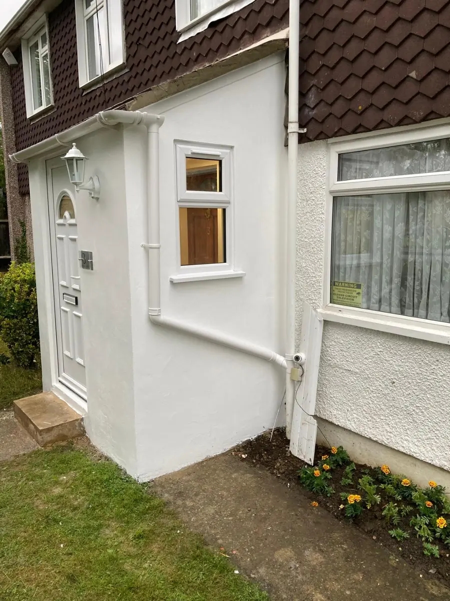 Completed rendered front entrance extension with new window